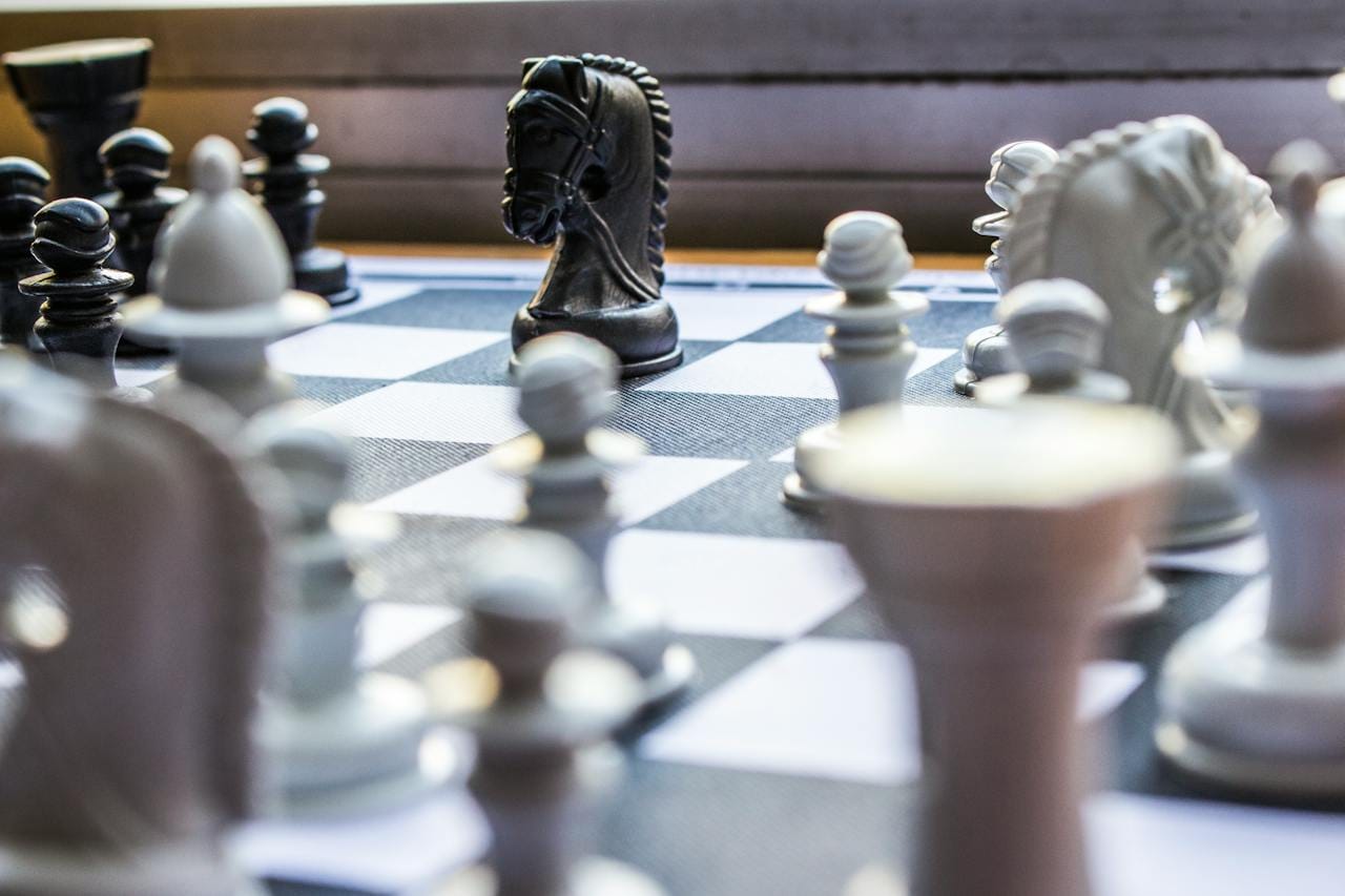 A picture of chess pieces on a board