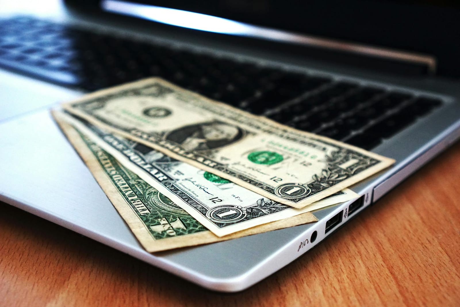 A close up of money on the laptop